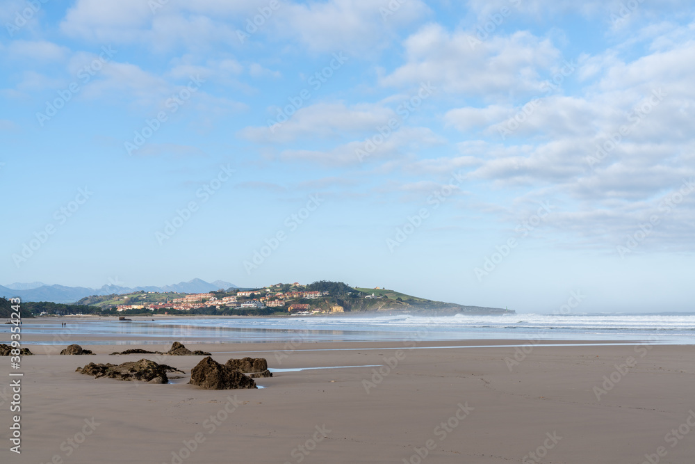 wide and empty sandy beach on the coast of Cantabria in northern Spain