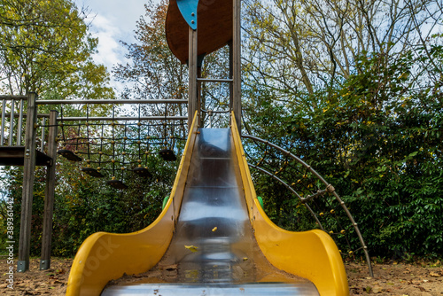 Wallpaper Mural Metal children's slide in autumn on a playground Torontodigital.ca