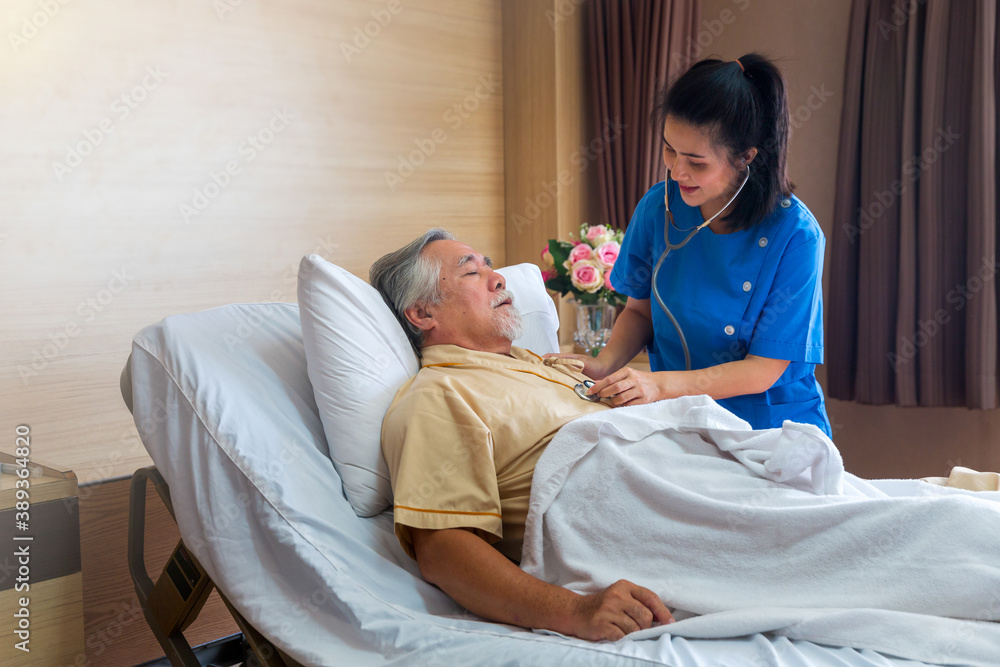 Obraz premium The doctor is examining an elderly patient in a special room. Female doctor examining coughing senior patient in room.