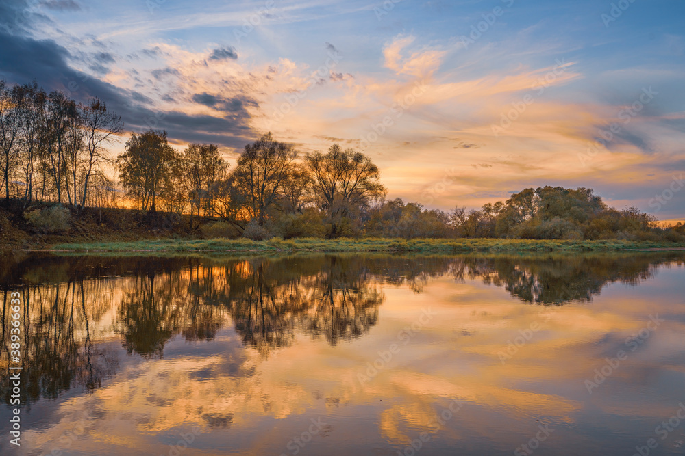 Autumn sunrise over the river in Moscow Region, Russia
