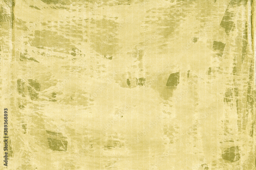 Fototapeta premium A yellow vintage rough sheet of carton. Recycled environmentally friendly cardboard paper texture. Simple and bright minimalist papercraft background. 