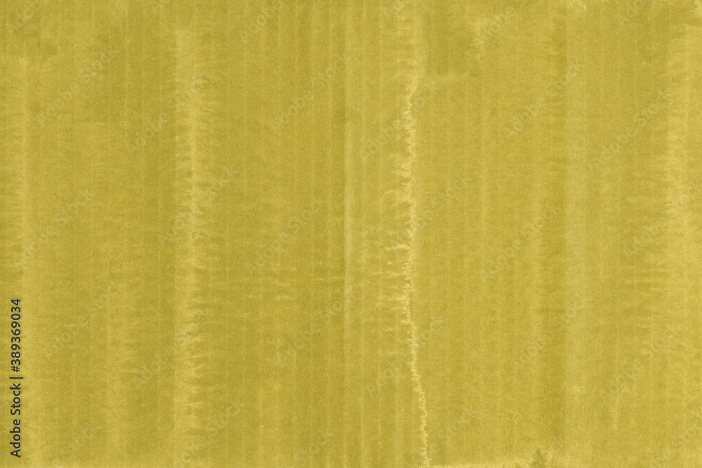 Fototapeta premium A yellow vintage rough sheet of carton. Recycled environmentally friendly cardboard paper texture. Simple and bright minimalist papercraft background. 