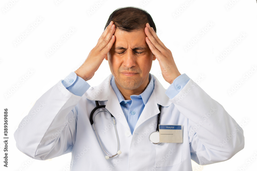 Studio shot of a handsome young male doctor suffering from a headache against a white background Studio shot of a handsome young male doctor suffering from a headache against a white background