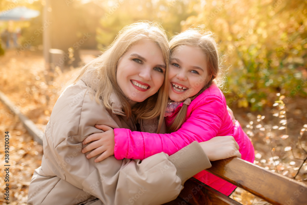 Caucasian beautiful family mom and little daughter on a walk in the park in autumn in October
Caucasian beautiful family mom and little daughter on a walk in the park in autumn in October