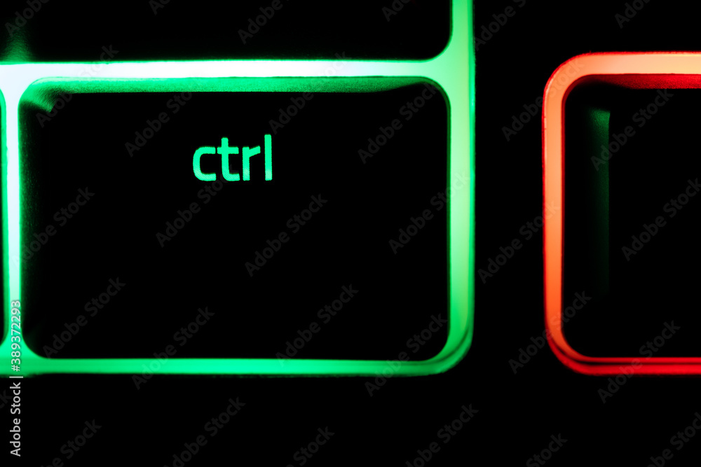 Green illuminated keyboard Ctrl control key closeup Green illuminated keyboard Ctrl control key closeup