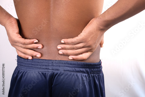 young man suffering back pain close up © Towfiqu Barbhuiya 