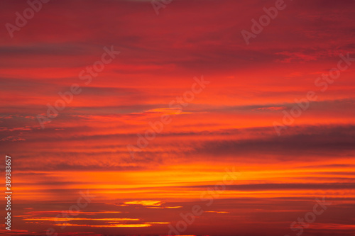 Dramatic red-orange blurred background of the setting sun. Abstract natural multicolor background © Liliya