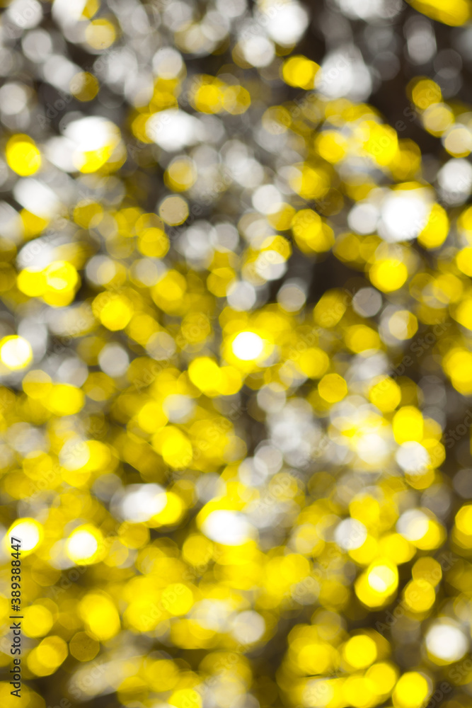 Defocused abstract bright yellow christmas background for your design Defocused abstract bright yellow christmas background for your design