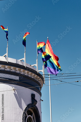 Photography Vertical shot of the pride flags on top of a building in San Francisco, Californ