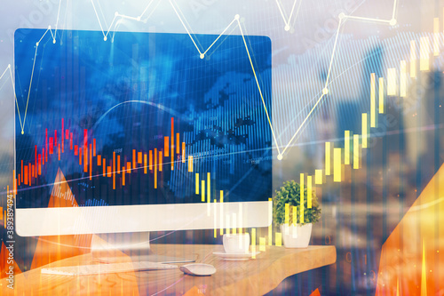 Financial graph colorful drawing and table with computer on background. Multi exposure. Concept of international markets. © peshkova