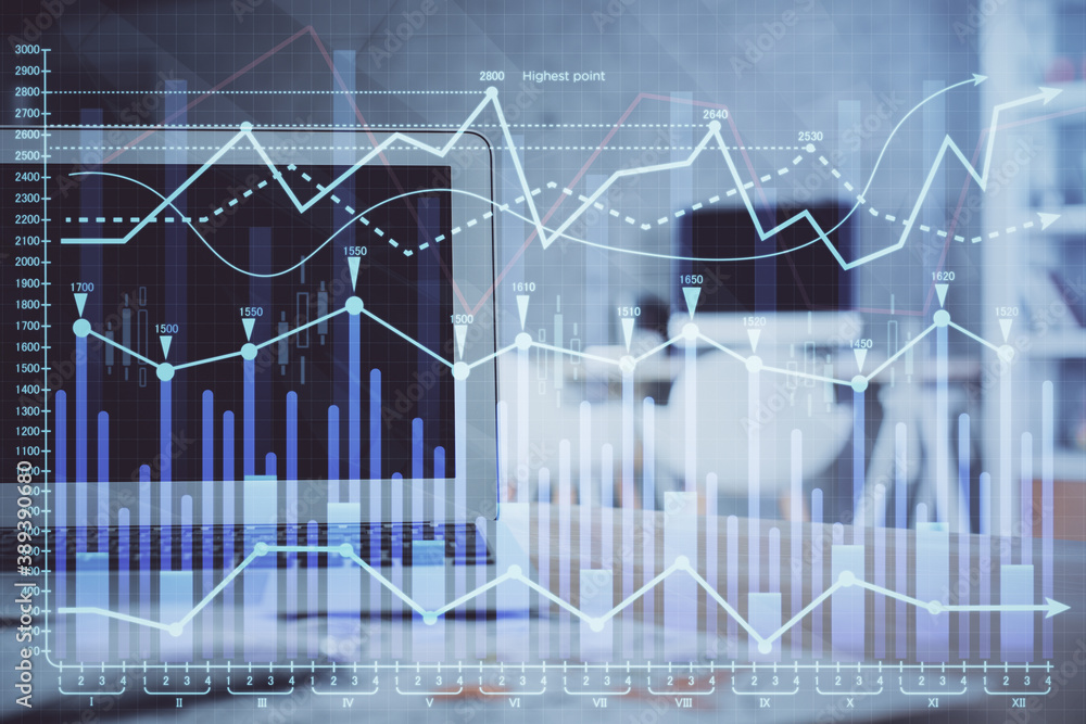 Forex market graph hologram and personal computer on background. Multi exposure. Concept of investment. Forex market graph hologram and personal computer on background. Multi exposure. Concept of investment.