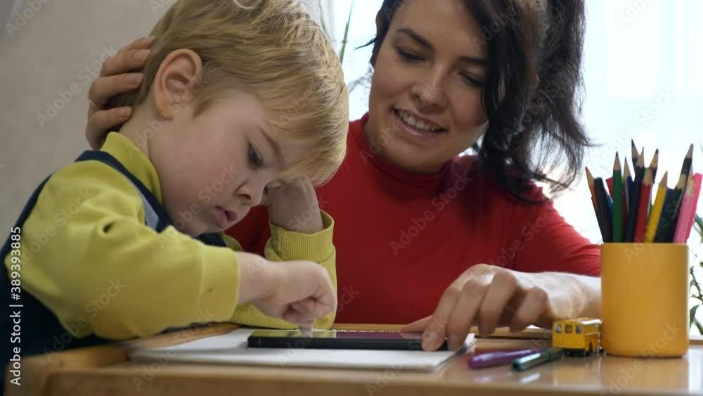 Mother Emboldens Praises and Encourages Son while Teaching. Boy Learns Drawing. Child Education at Home. 2x Slow motion 60 fps 4K Mother Emboldens Praises and Encourages Son while Teaching. Boy Learns Drawing. Child Education at Home. 2x Slow motion 60 fps 4K