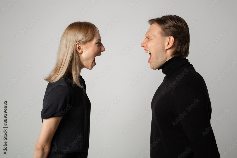 young beautiful couple man and woman in a quarrel young beautiful couple man and woman in a quarrel