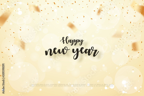 Happy new year text with black writing and blur gold background.