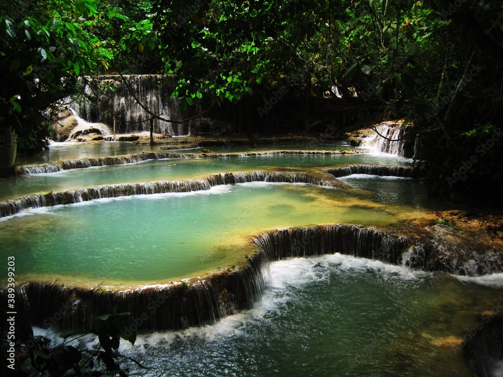 Fototapeta premium Backpacking through the waterfalls and jungles down the Mekong River in Laos, Southeast Asia