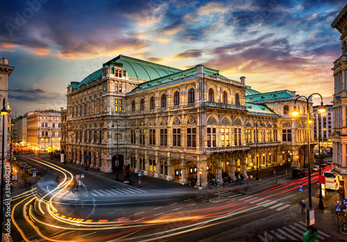Fototapeta Naklejka Na Ścianę i Meble -  Vienna State Opera. Veinna, Austria. Evening view. The historic opera house is a symbol and landmark of the city of Vienna.  Panoramic view, long exposure.