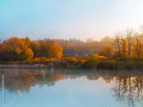 Beautiful forest with autumn foliage on dawn. Autumn landscape  bridges  reflected in the water  soft focus