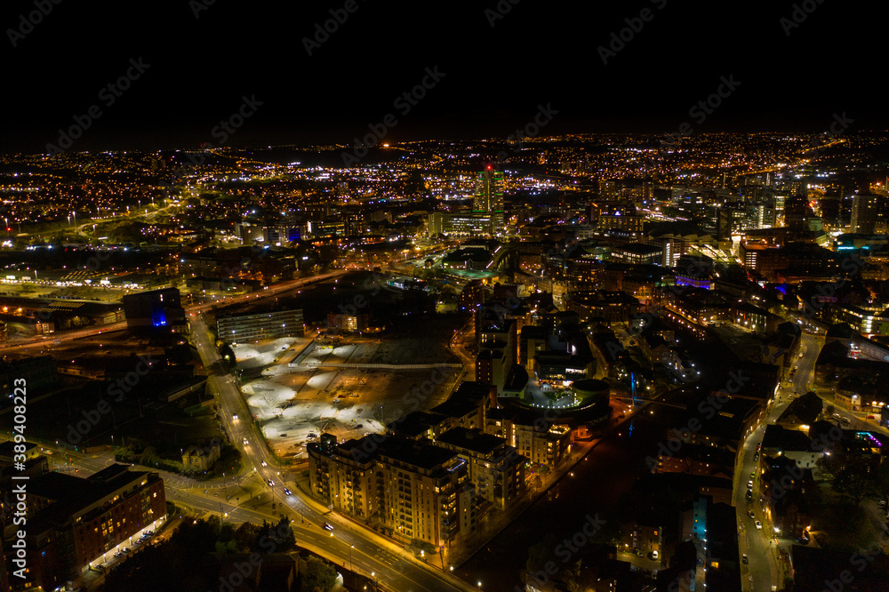 Night time aerial photo of the the town centre of Leeds in the UK, showing the West Yorkshire British city from above in the evening time