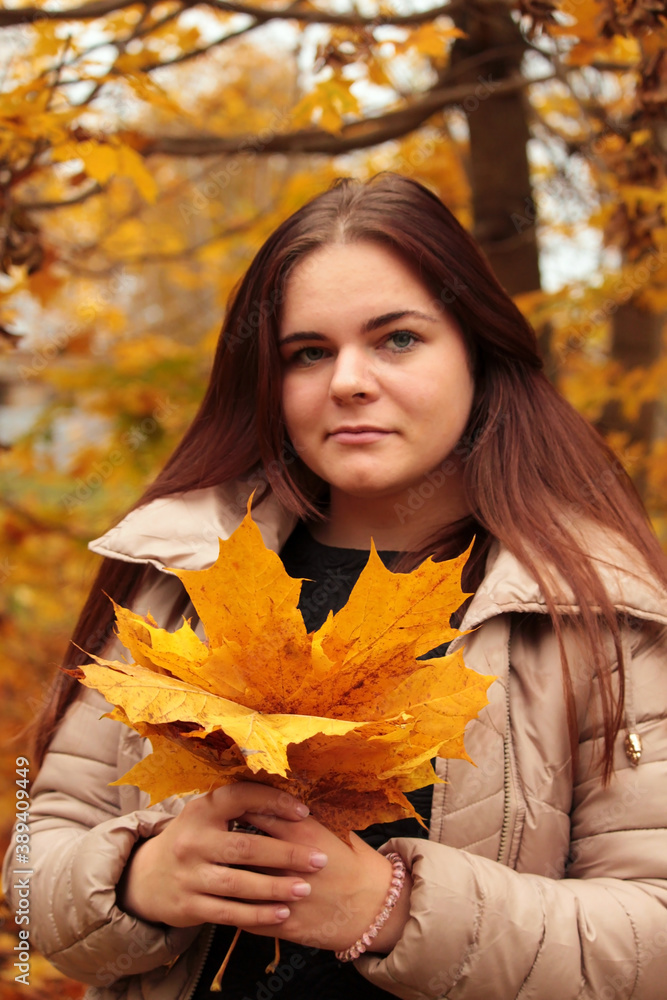 Happy Woman Enjoying Life in the Autumn on the Nature Happy Woman Enjoying Life in the Autumn on the Nature