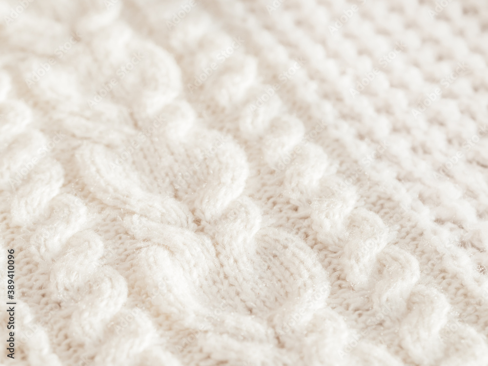 Hand made cable-knit sweater sweater. Texture of warm knitted fabric with pattern. White cardigan. Cozy autumn outfit for snuggle weather. Hand made cable-knit sweater sweater. Texture of warm knitted fabric with pattern. White cardigan. Cozy autumn outfit for snuggle weather.