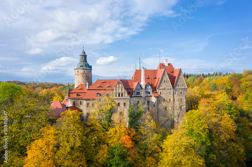 Aerial view of Czocha Castle surrounded by autumn yellow trees, Poland 