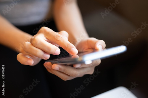 Women are typing messages choose products online,in the coffee cafe.