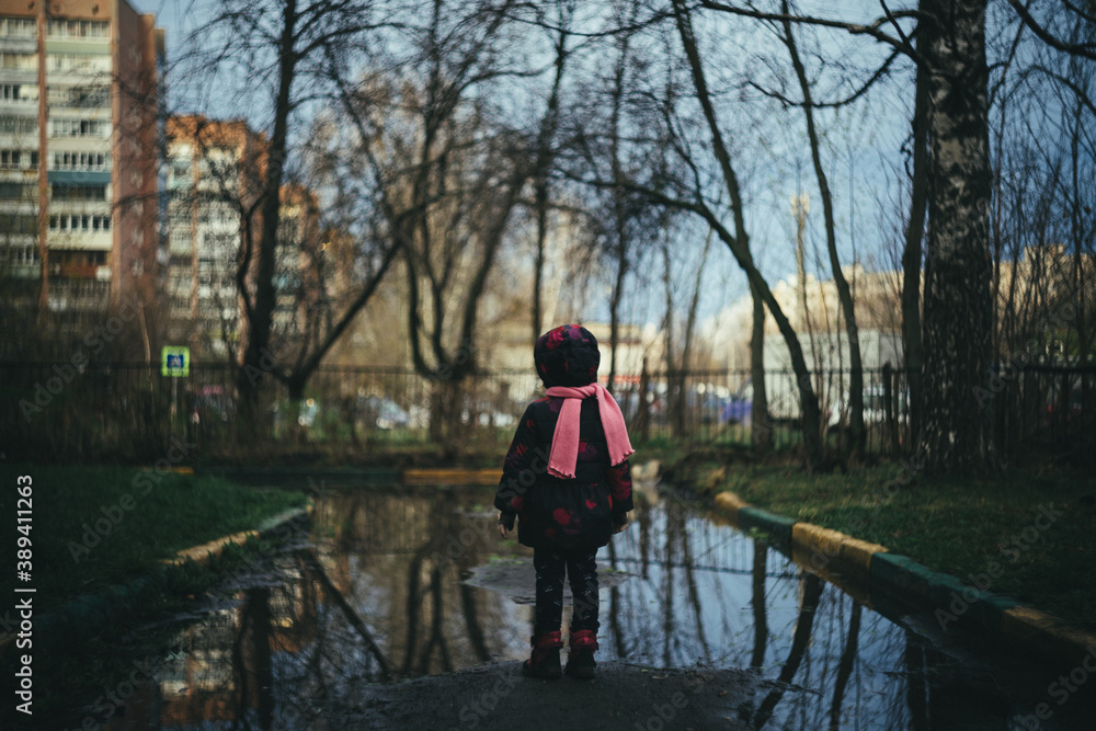 Fototapeta premium person walking on a bridge