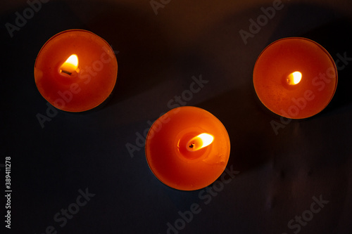 Quadro em tela Composition of three candles on dark luxury night background