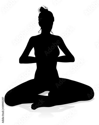 A silhouette of a woman in a yoga or pilates pose