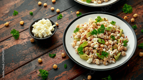 Chickpeas salad with feta cheese, avocado and herbs. healthy food