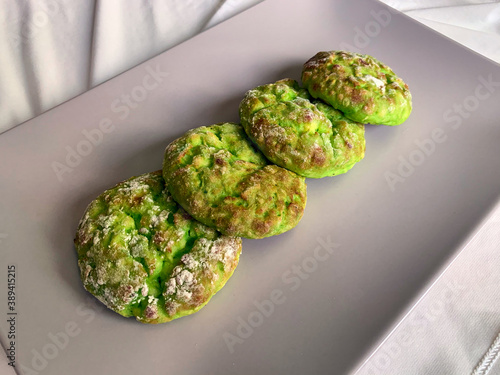 Vegetarian food on a gray plate. Green spinach and broccoli cheesecakes. High quality photo photo