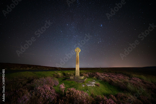 Milky way and foreground cross at North York Moors, Rosedale, UK.
