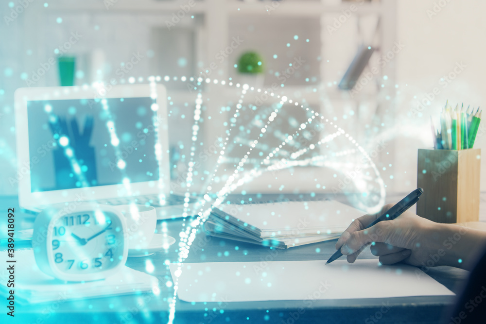 DNA theme hologram over woman's hands writing background. Concept of education. Double exposure DNA theme hologram over woman's hands writing background. Concept of education. Double exposure