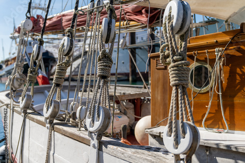 close up view of the rigging on an old classic wooden sailboat