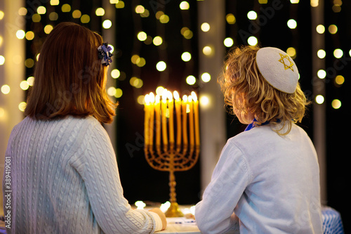 Photo Kids celebrating Hanukkah. Festival of lights.