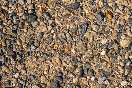 sfondo naturale composto da sassi di varie misure e colori e terriccio photo