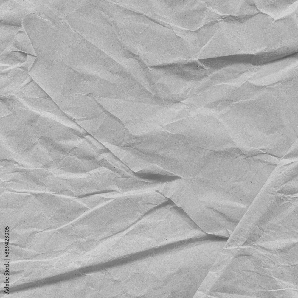 Fototapeta premium White vintage and old looking crumpled paper background. Retro cardboard texture. Grunge paper for drawing. Ancient book page. Present wrapping.