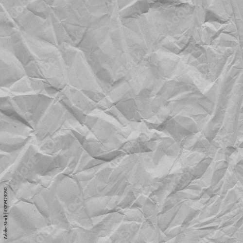 White vintage and old looking crumpled paper background. Retro cardboard texture. Grunge paper for drawing. Ancient book page. Present wrapping.