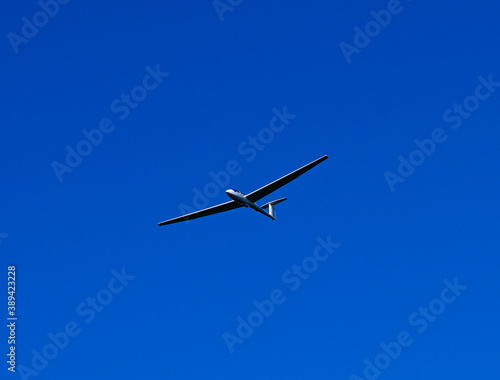 Single seat glider in flight over German countryside near Baden Baden_Baden Wuerttemberg, Germany