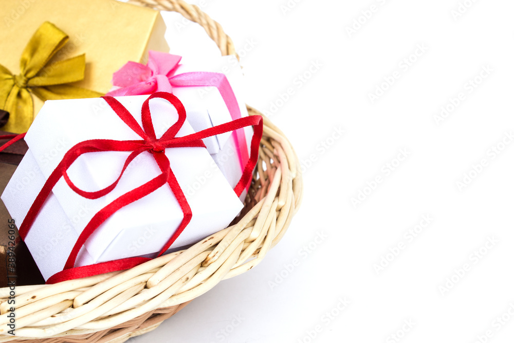 Gift basket isolated on a white background. The concept of gifts and congratulations for the holidays. Copy space.