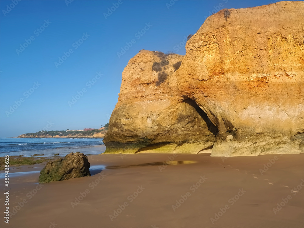 Hinking at the beach of Praia Maria Luisa, Olhos da Agua, Albufeira, at the Algarve coast of Portugal