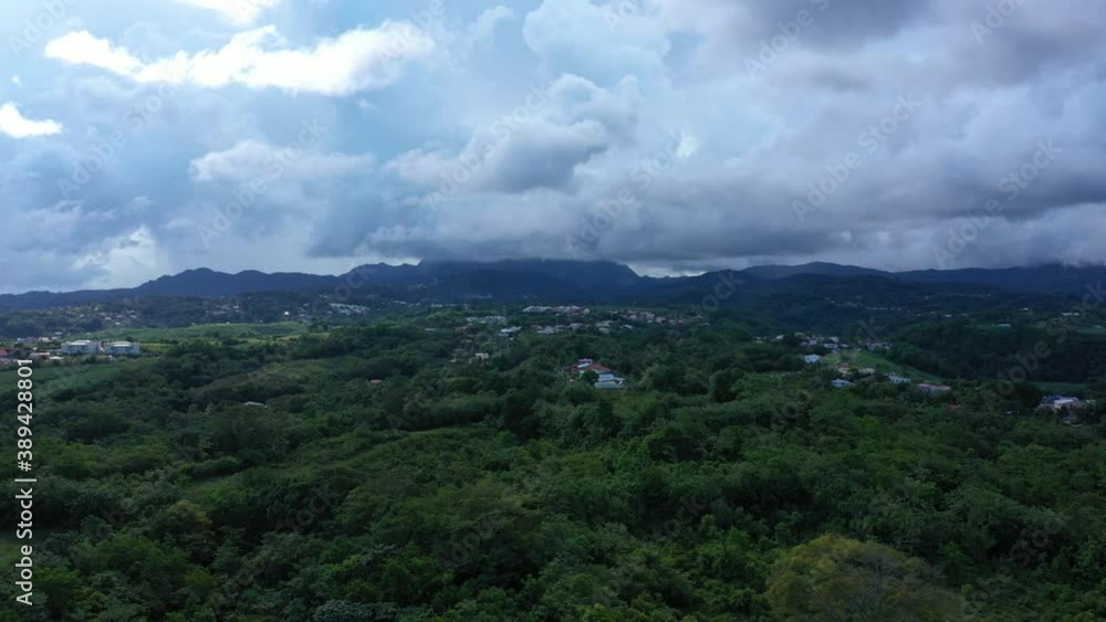 Martinique rural area countryside dense vegetation clouds in the mountains aerial shot Martinique rural area countryside dense vegetation clouds in the mountains aerial shot