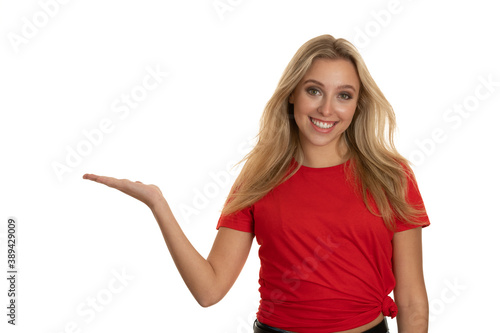 Wallpaper Mural Beautiful young woman in red tshirt point in copy space Torontodigital.ca