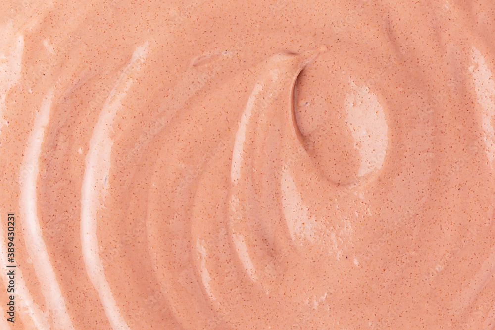 Fototapeta premium Textured cosmetic gel scrub for face and body made from sea salt and natural clay. Beauty texture. Selective focus