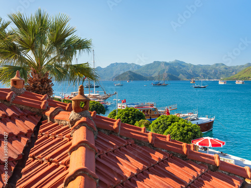 roof view to the sea and yachts under blue sky in sunny day with copy space in a sky