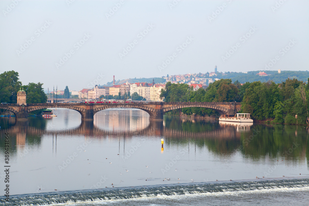 View on the Legion Bridge and Vltava  in  Prague, Czech Republic. Tram on the bridge.