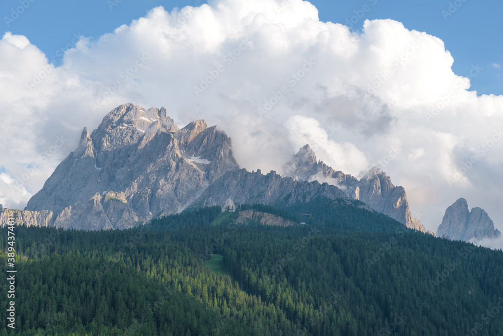 View to the summit of the croda rossa mountain with clouds in Italy.