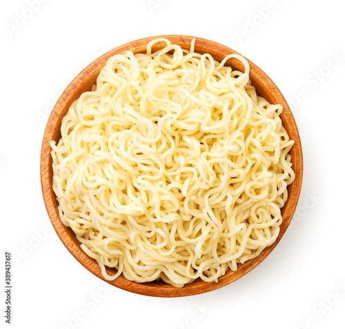 Noodles in a wooden bowl on a white background, isolated. The view from top