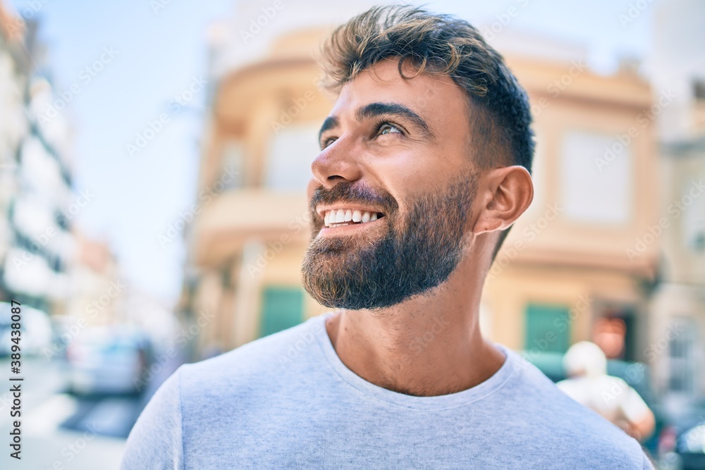 Young hispanic man smiling happy walking at the city Young hispanic man smiling happy walking at the city