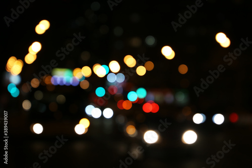 Blur city light of cars headlights on the night road. Colorful urban abstract background © Oleg
